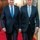 Presidents Joe Biden and Bill Clinton walking to the East Room with Vice-President Kamala Harris (not shown)