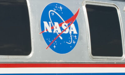 NASA meatball logo on an aircraft fuselage between two windows