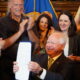 Tim Walz conducting a bill signing with several onlookers