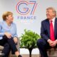 Donald Trump talks to German Chancellor Angela Merkel at the Biarritz G7 summit