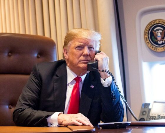 Donald Trump takes a phone call aboard Air Force One