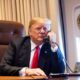 Donald Trump takes a phone call aboard Air Force One