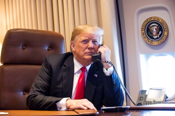 Donald Trump takes a phone call aboard Air Force One