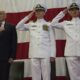 US SecHomeSec John Kelly, Captain William Huhm USN, and Lt Cmdr Charles Johnson USN aboard USS Kearsage LHD 3 at a change of command