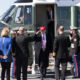 Donald Trump disembarks from Marine One and takes several salutes.