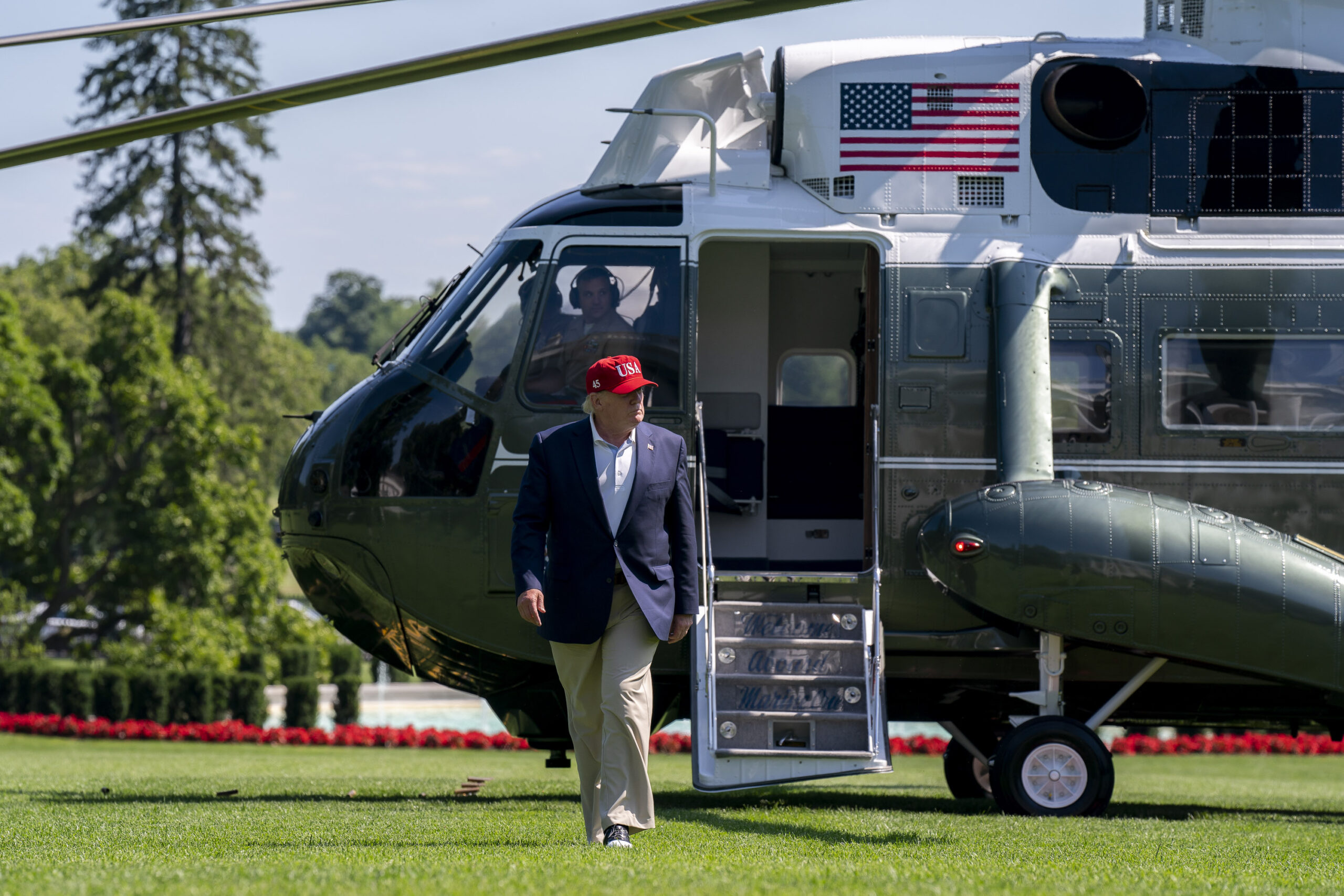 President Donald J. Trump steps off his Marine One VH-3D Sea King after touchdown at Camp David in Maryland.