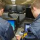 Two Secret Service agents, wearing official windbreakers, pore over computer monitors as they conduct a preliminary investigation