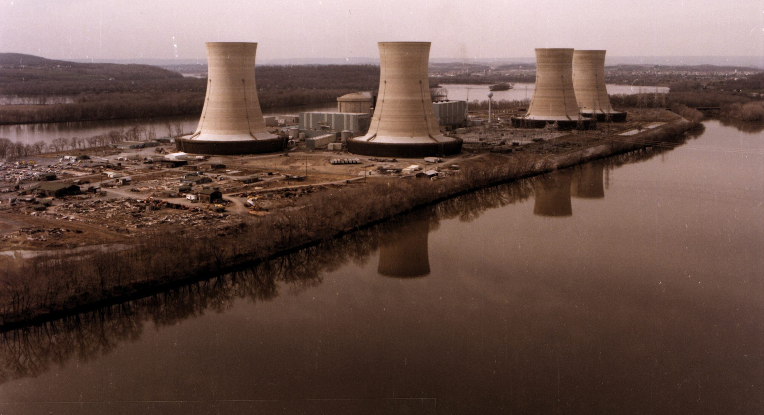 Three Mile Island, showing the containment building and four cooling towers of the nuclear power plant that bears the island's name