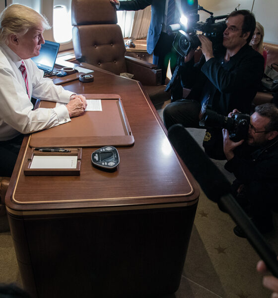 President Trump talks to reporters in his office aboard his special transport (call sign Air Force One) in flight from Philadelphia to Joint Base Andrews near Upper Marlboro, Maryland, 26 January 2017