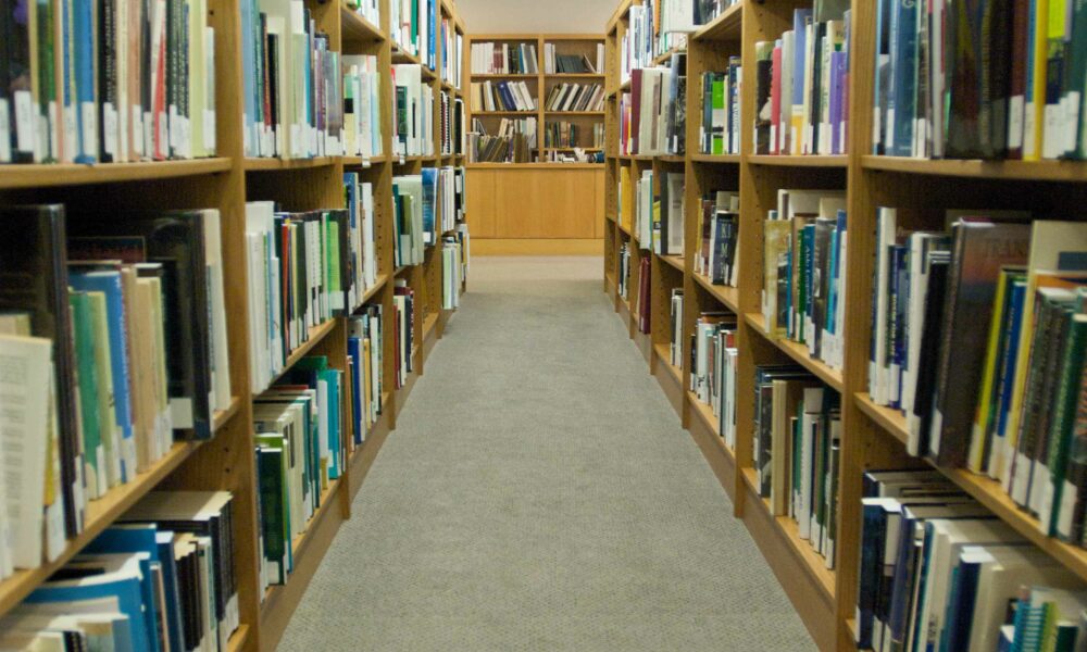 Library bookshelves, looking toward the reference desk