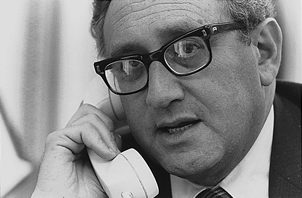 Henry Kissinger takes a telephone call