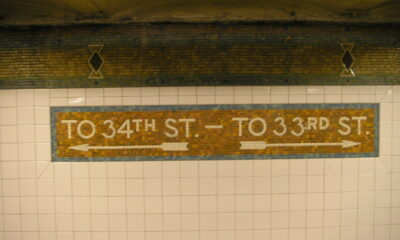 Tiled street exit markers in the New York City subway tunnel at its Pennsylvania Station stop