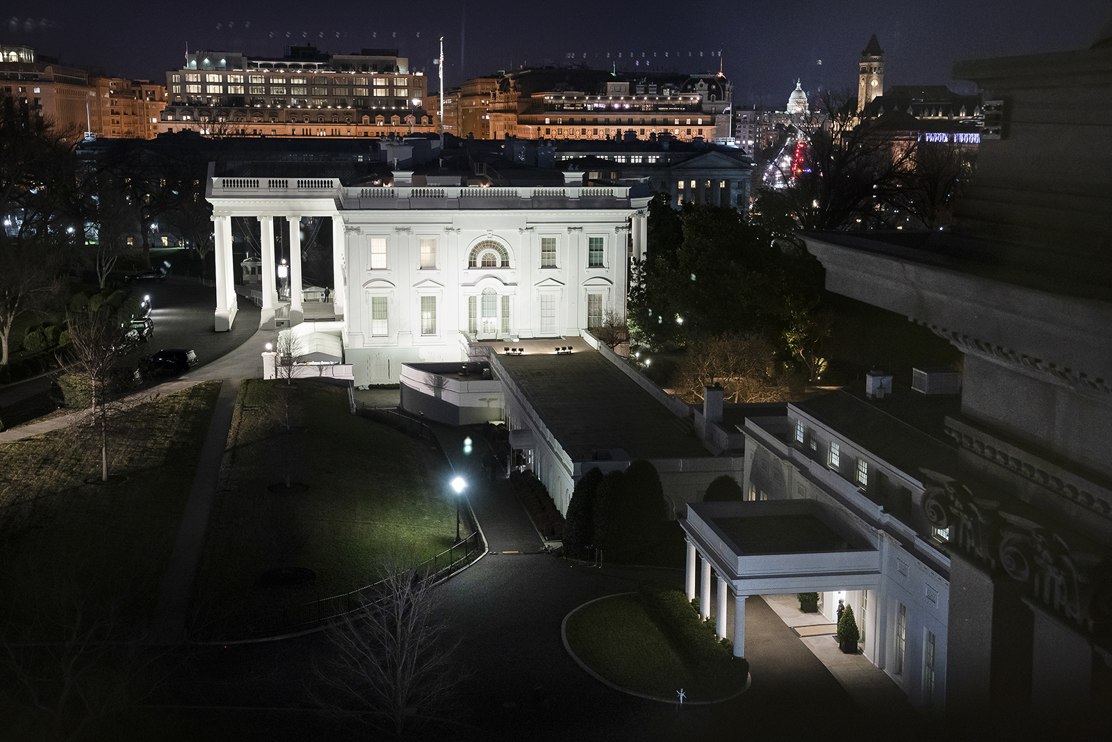 The White House and the West Wing, aerial view looking down Pennsylvania Avenue toward the Capitol