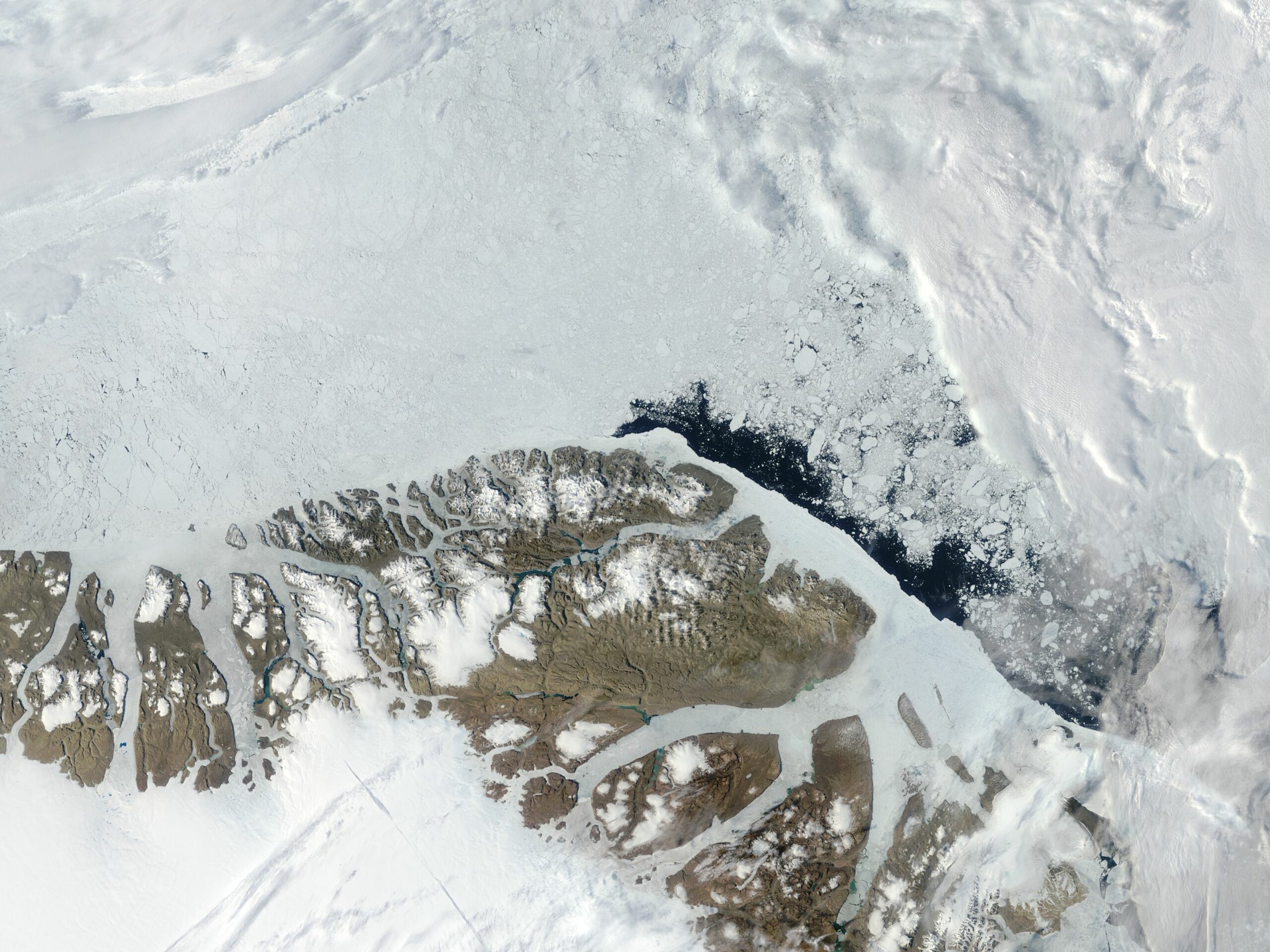 Greenland, overflying some of its mountains