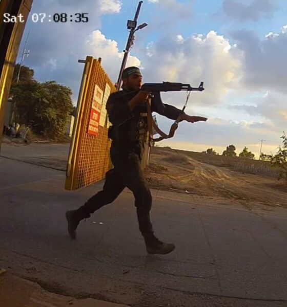 HAMAS gunmen storming a kibbutz on October 7, 2023