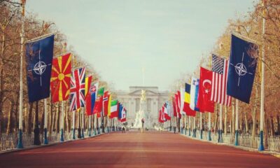 NATO and member States' flags along the Mall of London, looking toward Buckingham Palace.