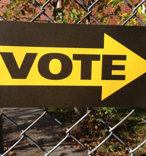 A sign outside a polling place directing people where to go to vote - symbol of democracy