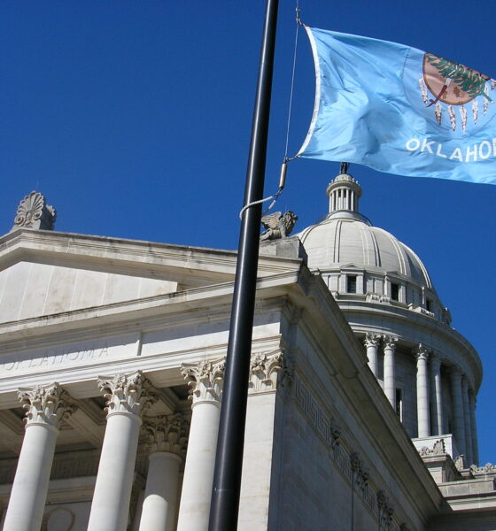 Capitol of Oklahoma with flag of Oklahoma