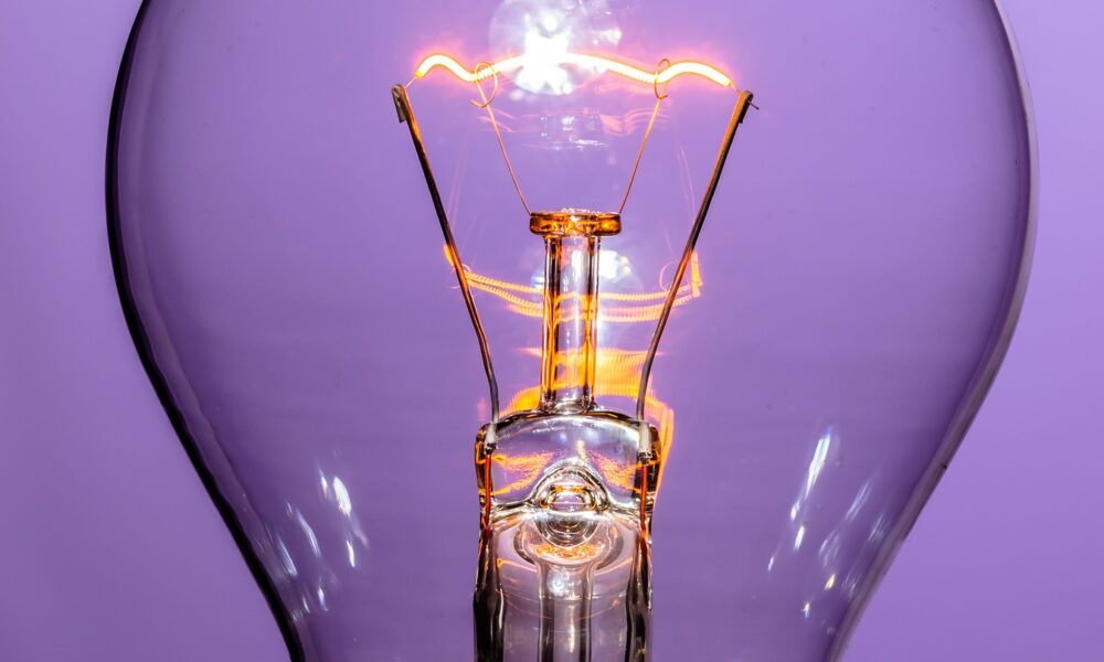A colorless, transparent incandescent lightbulb