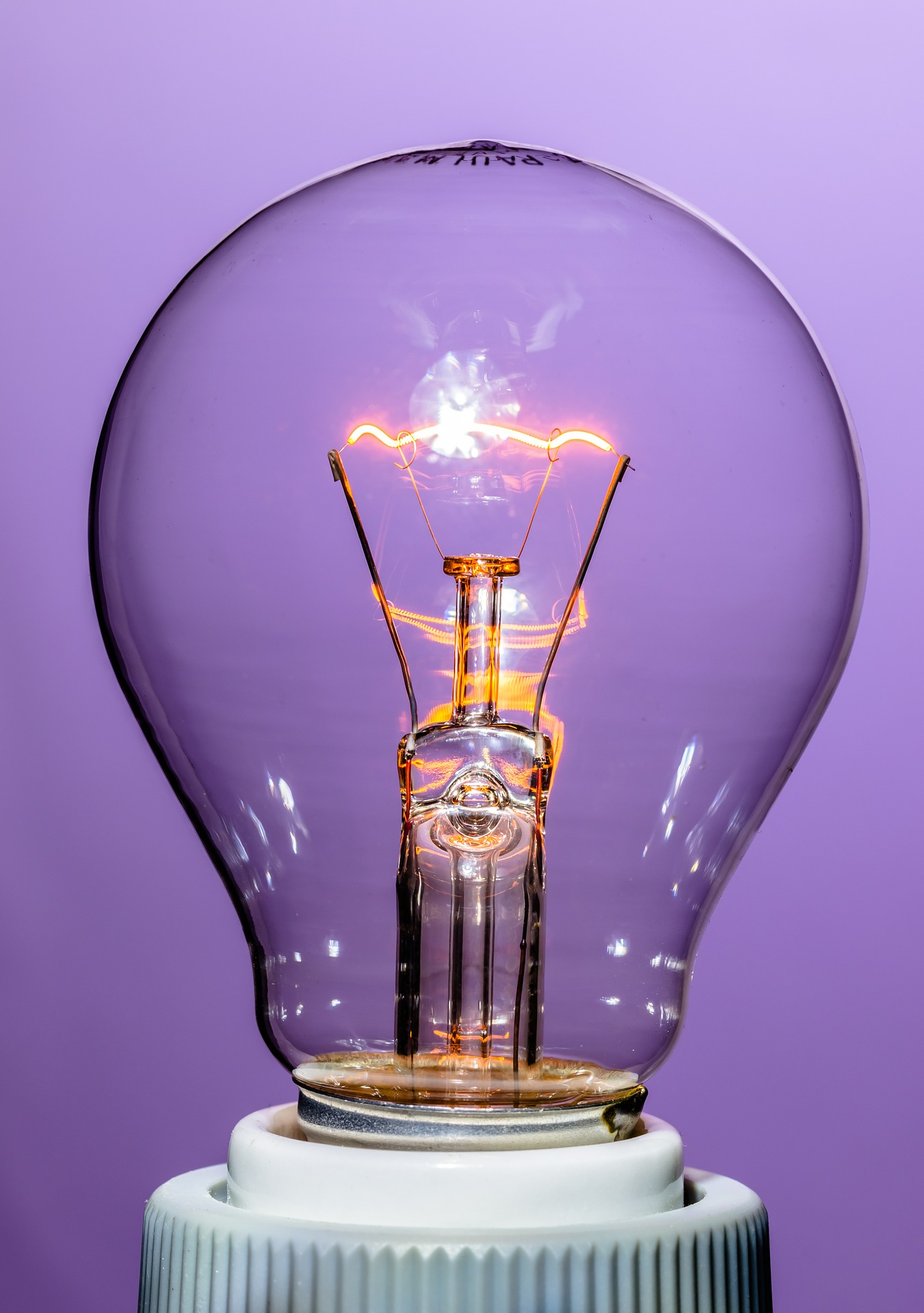 A colorless, transparent incandescent lightbulb