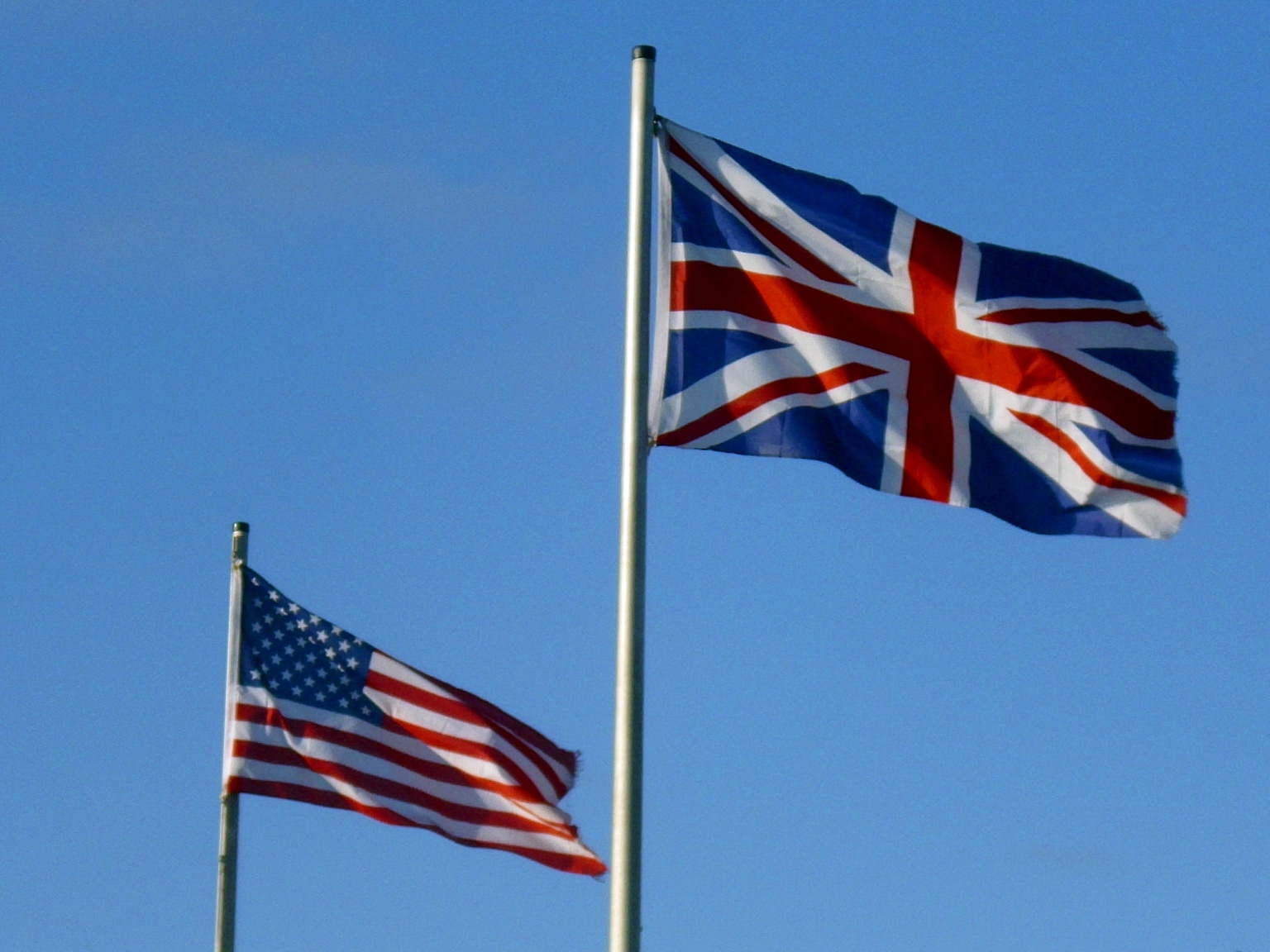 The flag of the United States flies alongside the Union Jack of the United Kingdom