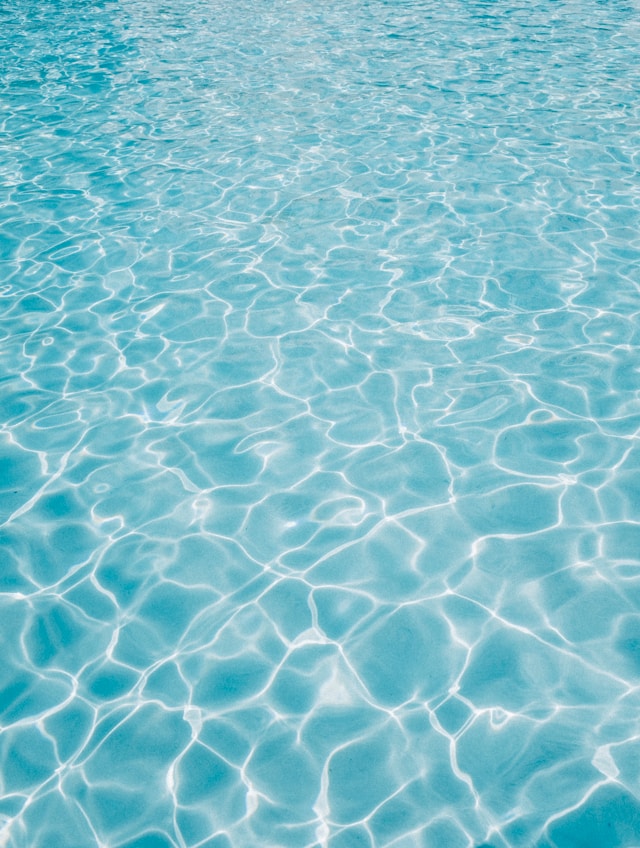 Rippling crystal blue water typical of a swimming pool