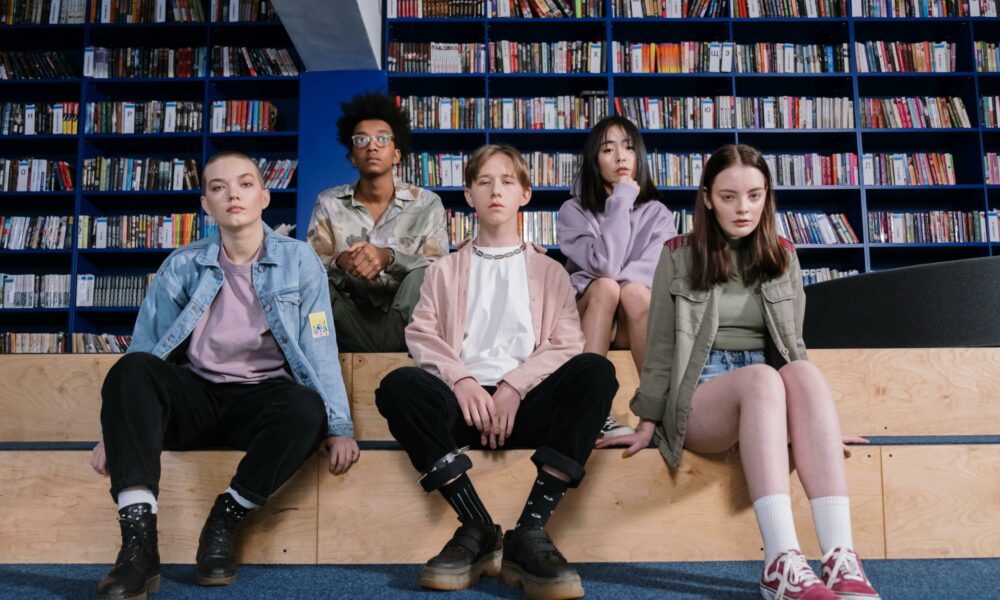 Teenagers sitting in a library