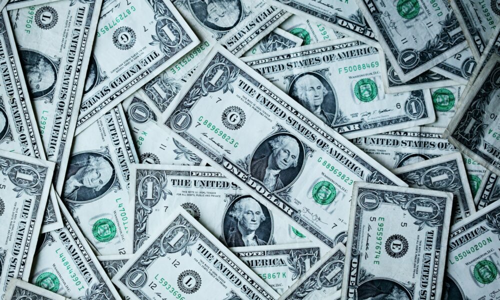 A collage of US dollar bills - photo coutesy Alexander Grey