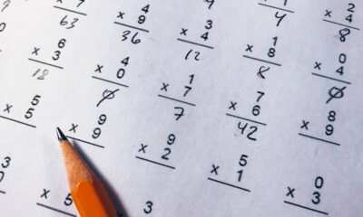 Brown pencil on paper with elementary single-digit multiplication exercises