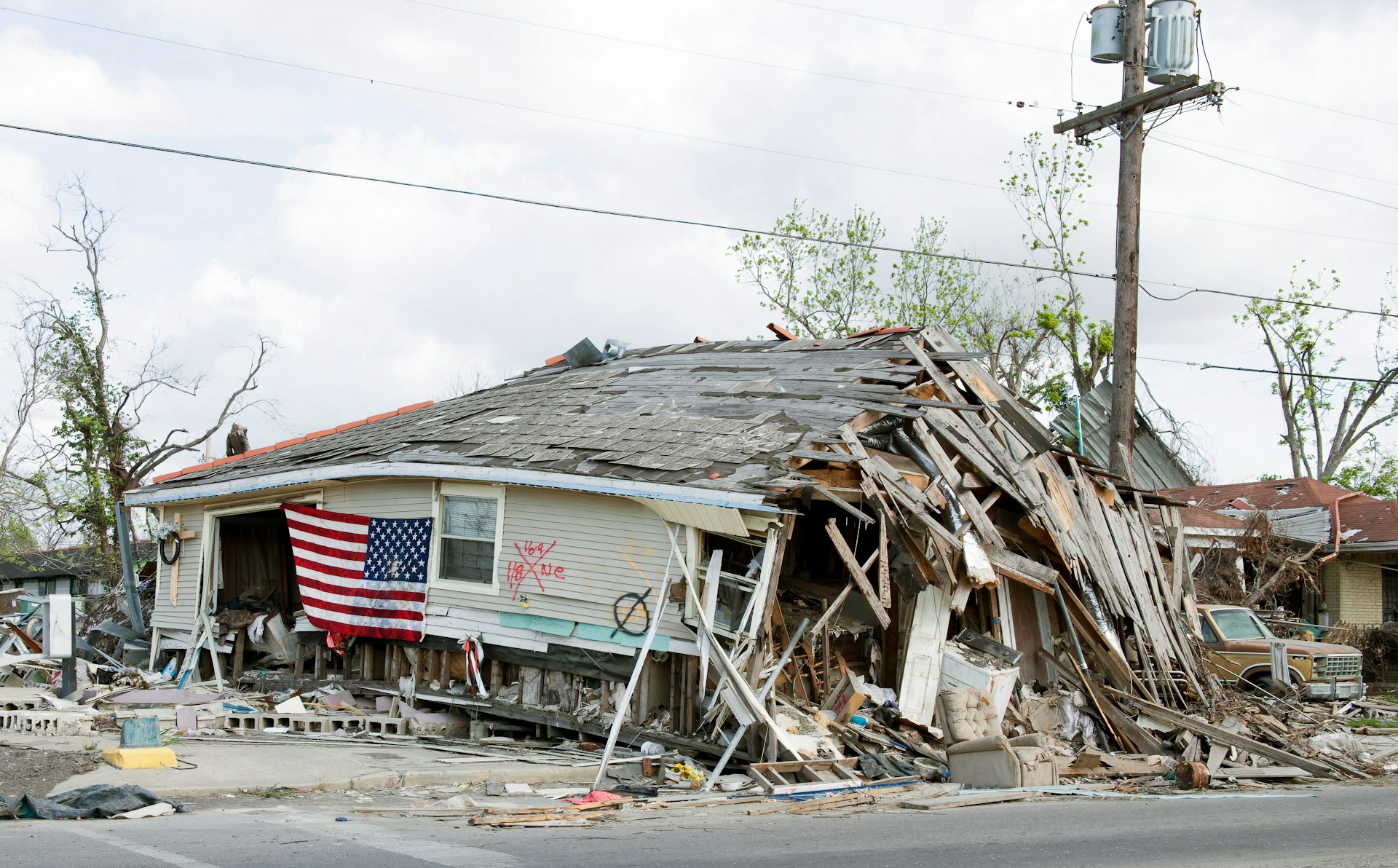 A barbershop in New Orleans' Ninth Ward ruined by Hurricane Katrina - photo uploaded to Unsplash by the Library of Congress