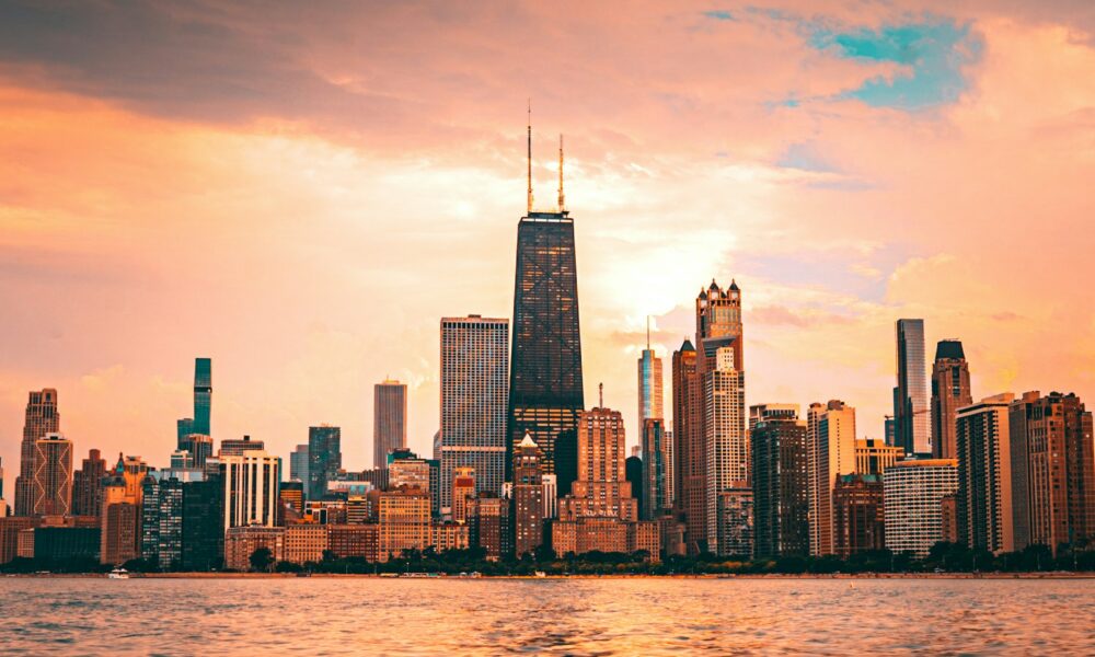 Chicago skyline from Lake Michigan at sunset, by Rihards Sergis