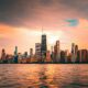 Chicago skyline from Lake Michigan at sunset, by Rihards Sergis