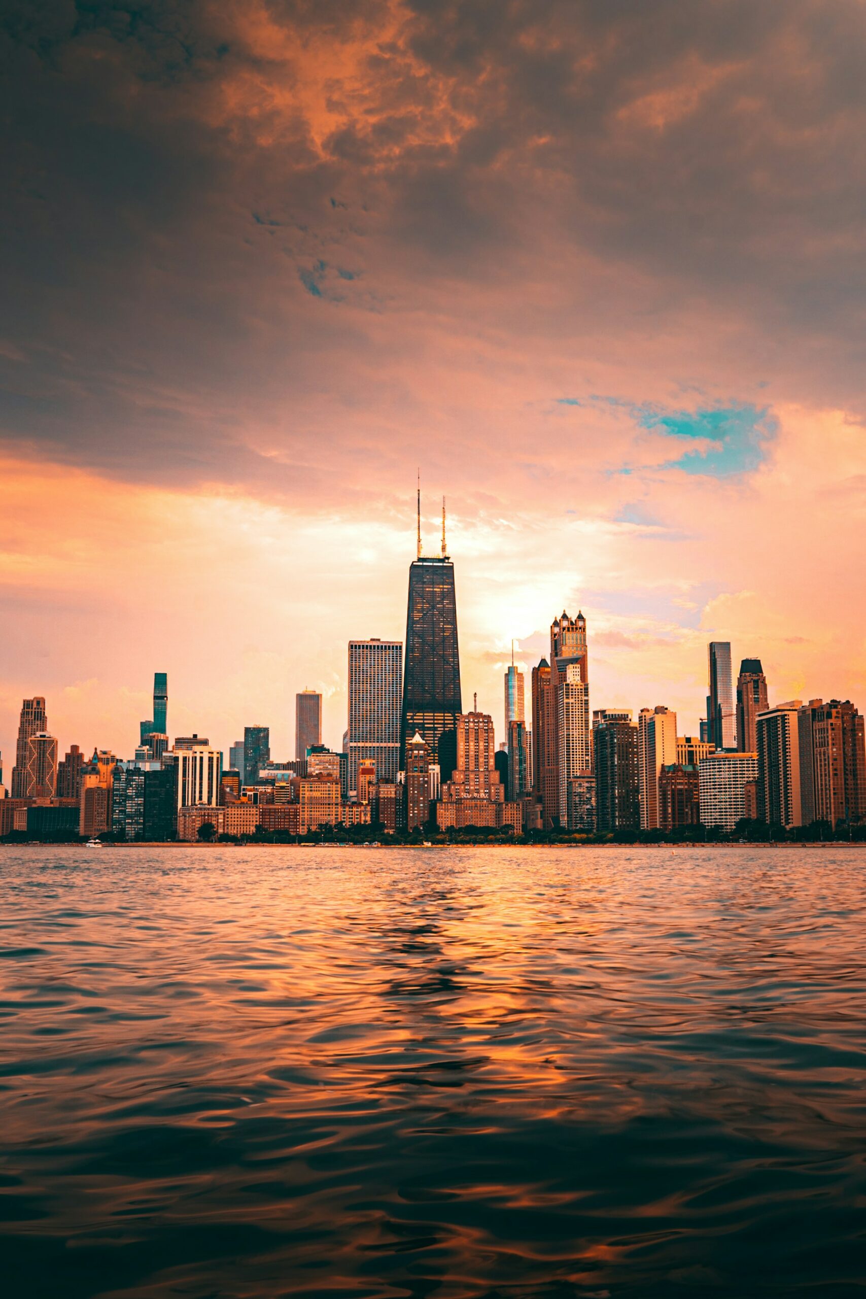 Chicago skyline from Lake Michigan at sunset, by Rihards Sergis