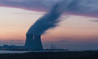 The cooling towers of a nuclear power plant, venting steam into the sunset - photo courtesy Frédéric Paulussen