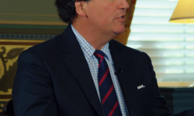 Tucker Carlson appears with Charlie Kirk