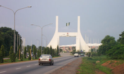 Main gate into Abuja, capital of Nigeria (note the English welcoming message).