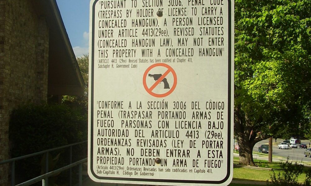 A property in Austin, Texas displays a private gun-free zone sign