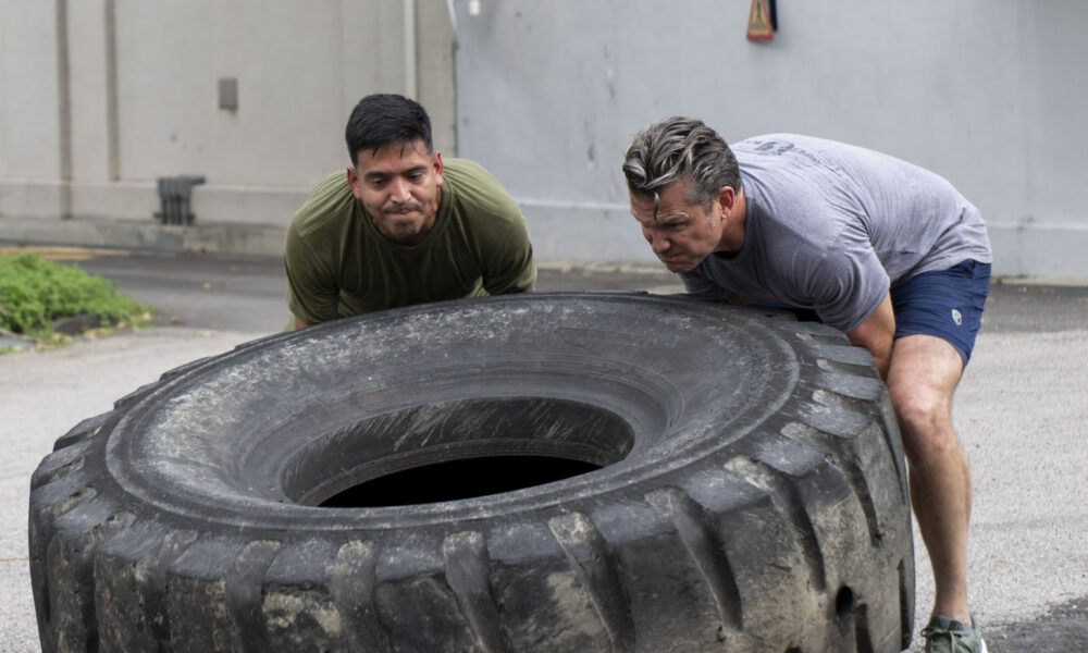Pete Hegseth and staff take part in physicial training in Kuala Lumpur