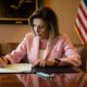Representative Nancy Pelosi (D-Calif.), then Speaker of the House, signs legislation removing an emergency declaration