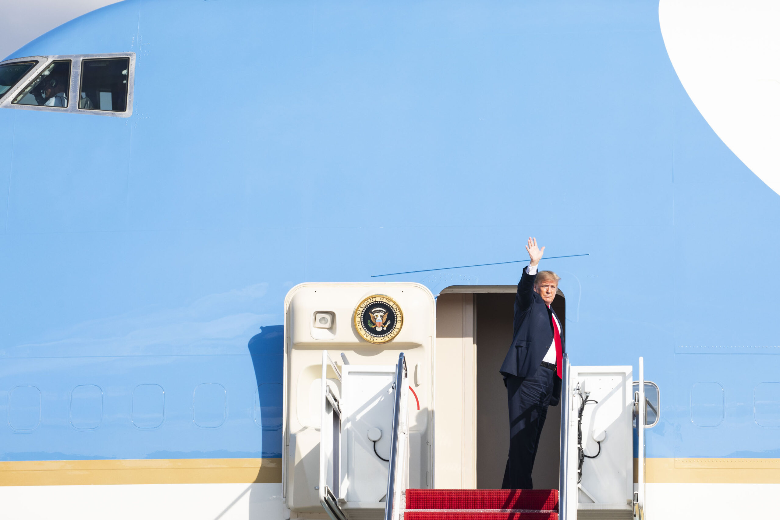 President Donald J. Trump boards his executive transport (call sign Air Force One)