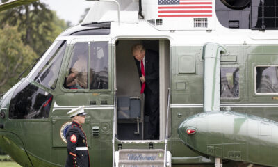 President Donald Trump aboard the Marine One VH-3D Presidential helicopter landing on the South Lawn