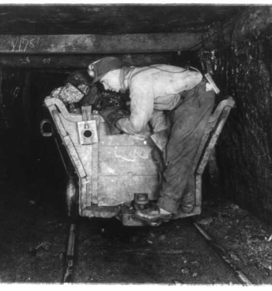 A coal miner and his equipment in the days of deep mining