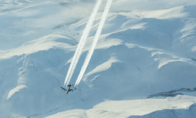 The High Arctic, with an E-3 Sentry (the AWACS platform) overflying some mountains