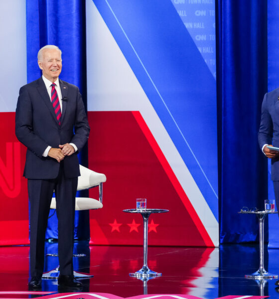 Don Lemon running a CNN Town Hall with President Joe Biden on stage