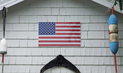 An American Flag on a shingled wall in Arlington, Massachusetts