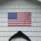 An American Flag on a shingled wall in Arlington, Massachusetts