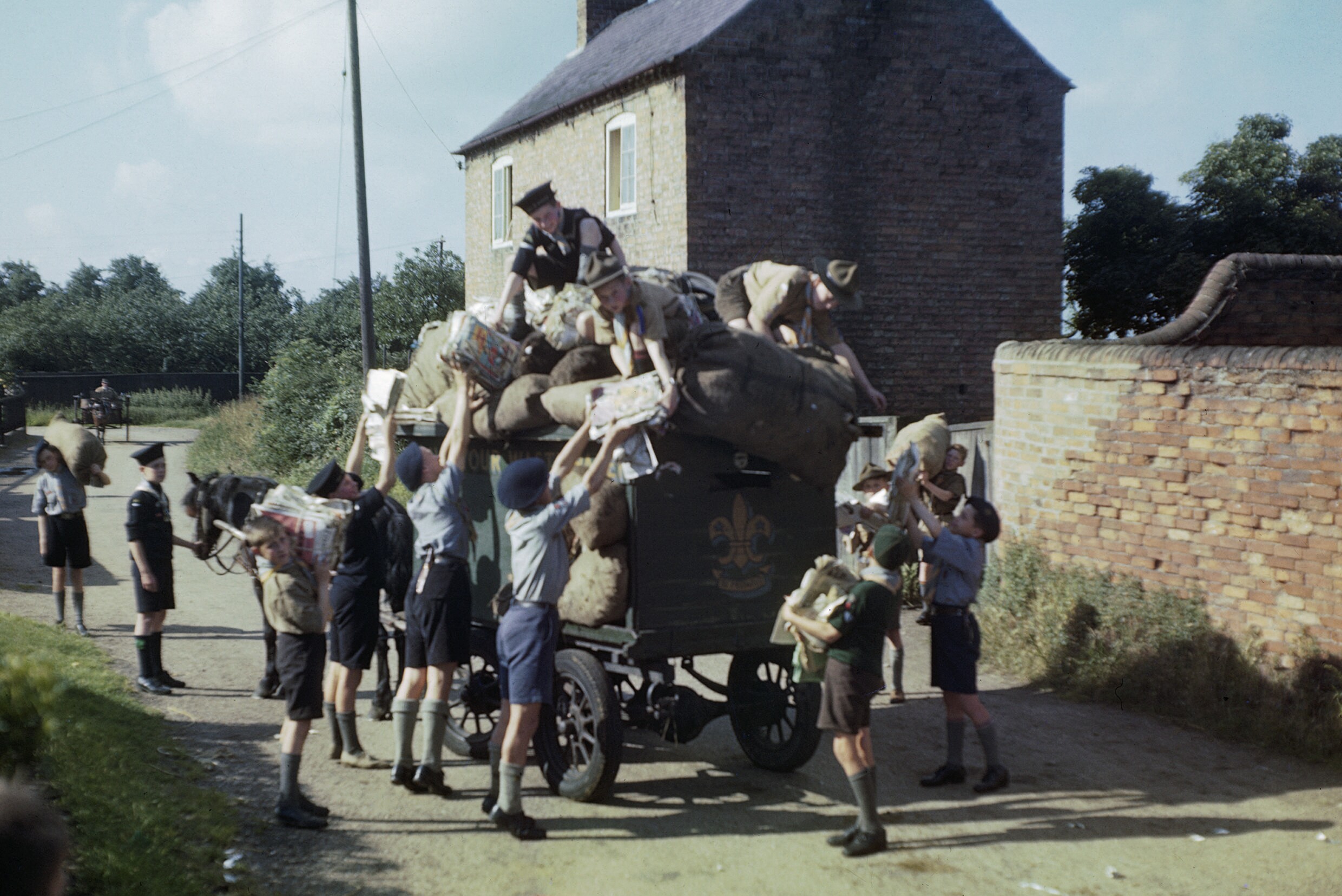 Boy Scouts, Cubs, and Sea Scouts collect recyclable paper in 1944