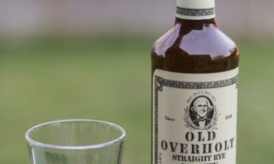 Rye whisky in bottle and poured on the rocks