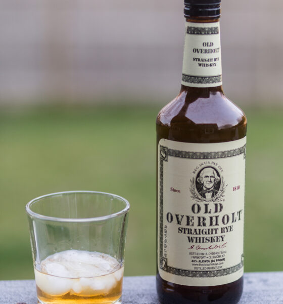 Rye whisky in bottle and poured on the rocks