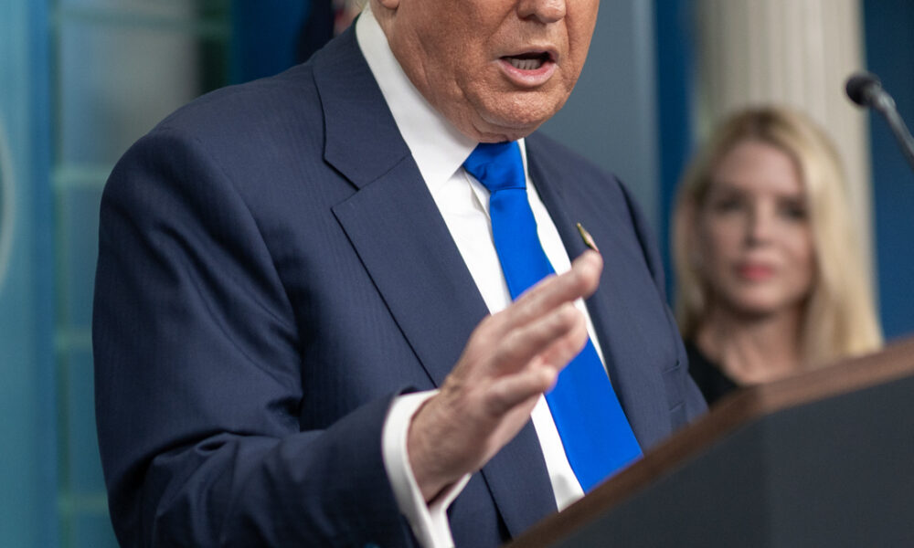 Trump holds a press conference with then Attorney General Pam Bondi in the background